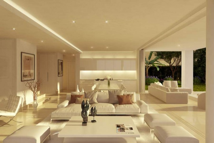 Wonderful modern interior design with open kitchen and floor-to-ceiling sliding glass doors of a luxury villa in Marbella, Spain