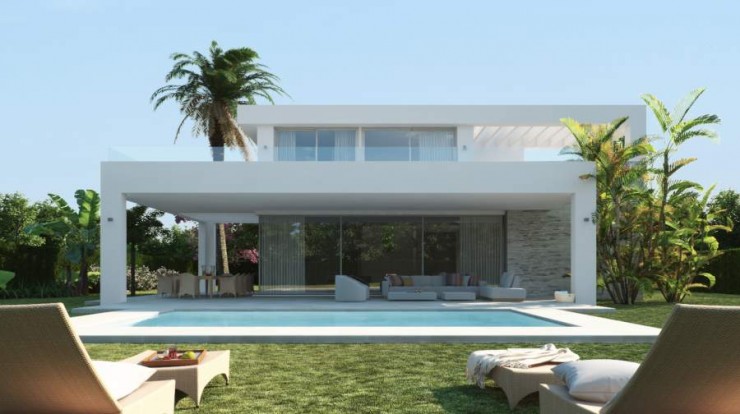 Front side of a villa with pool and gardens in Marbella, Spain